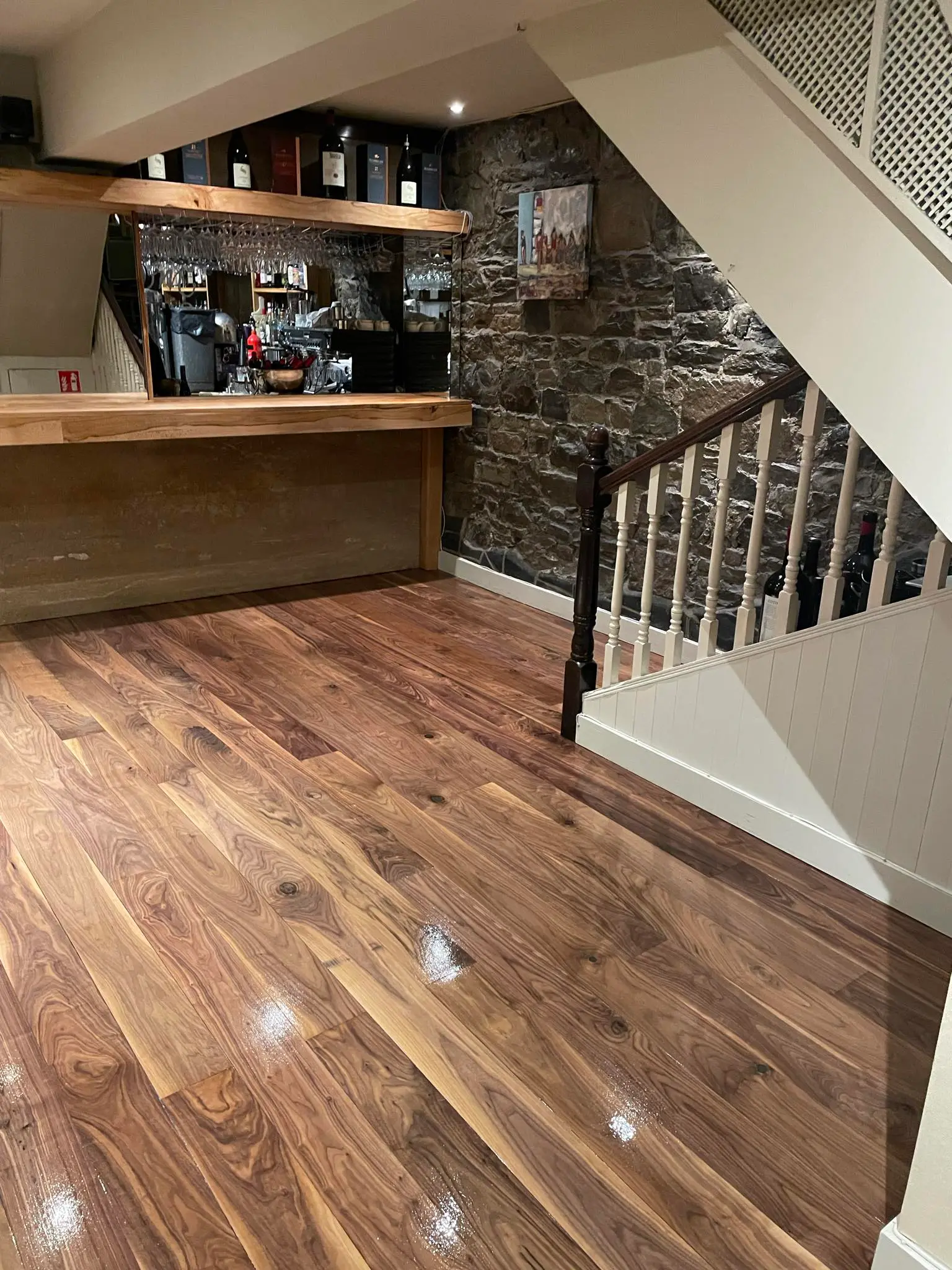 A wooden floor from a PUB perfectly sanded and stained with a nice coat.