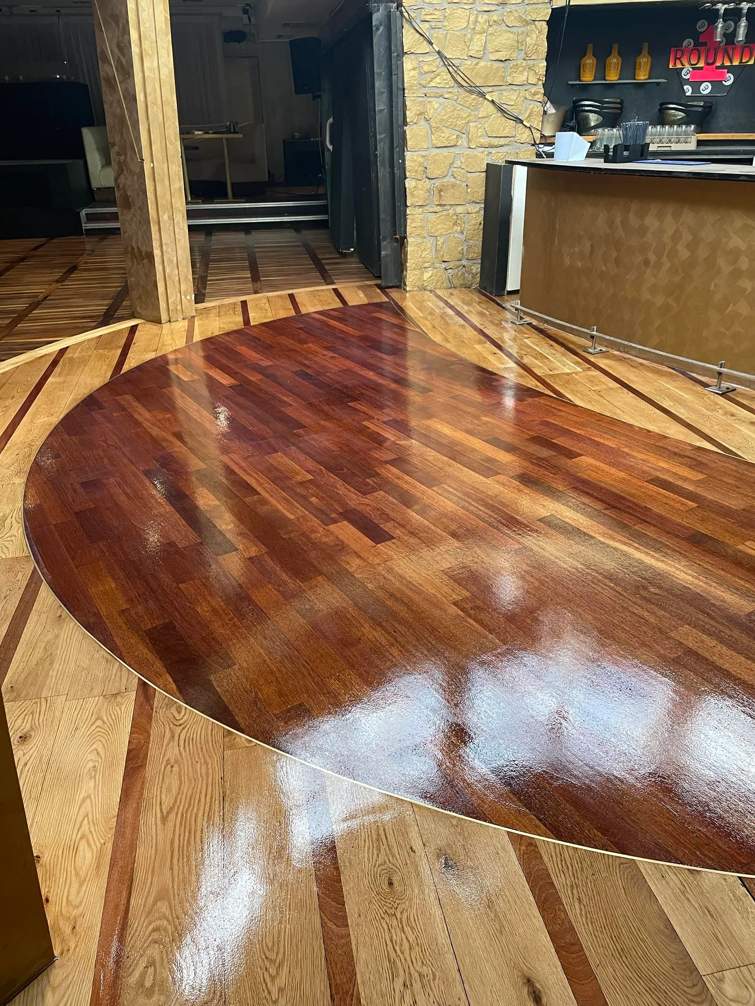 A business with decorations on the wooden floor sanded & stained.