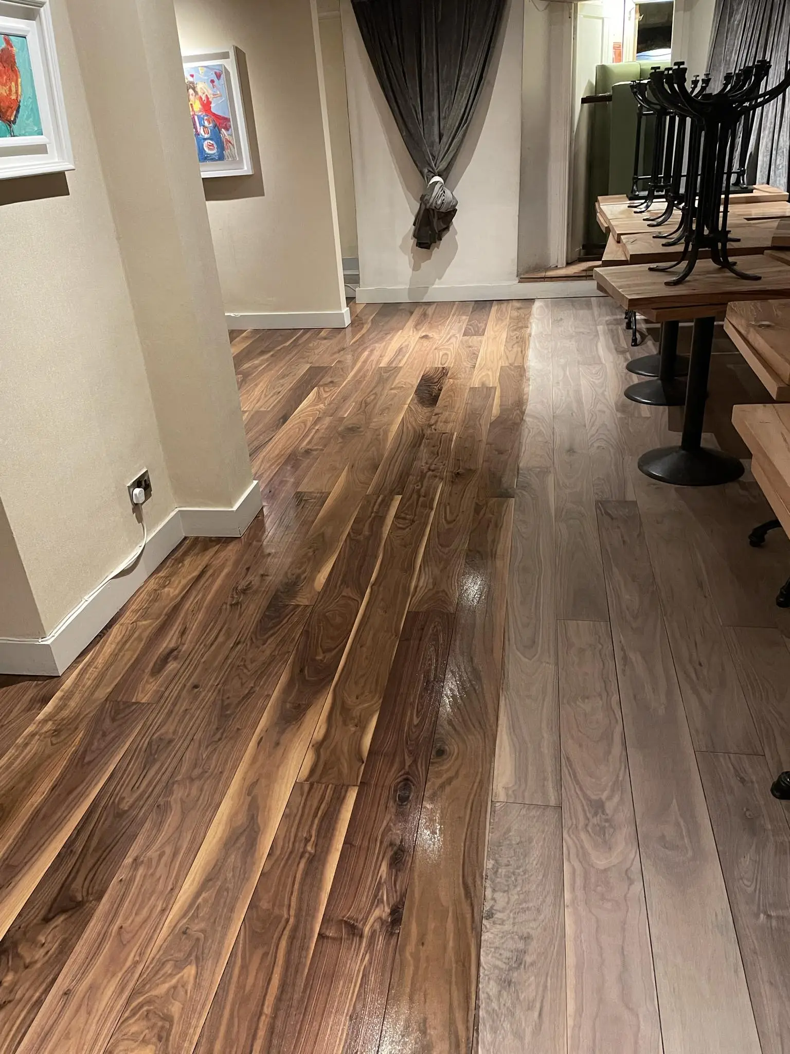 A solid wood floor perfectly sanded and stained.