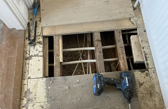 A photo of wooden floor in the remove process.