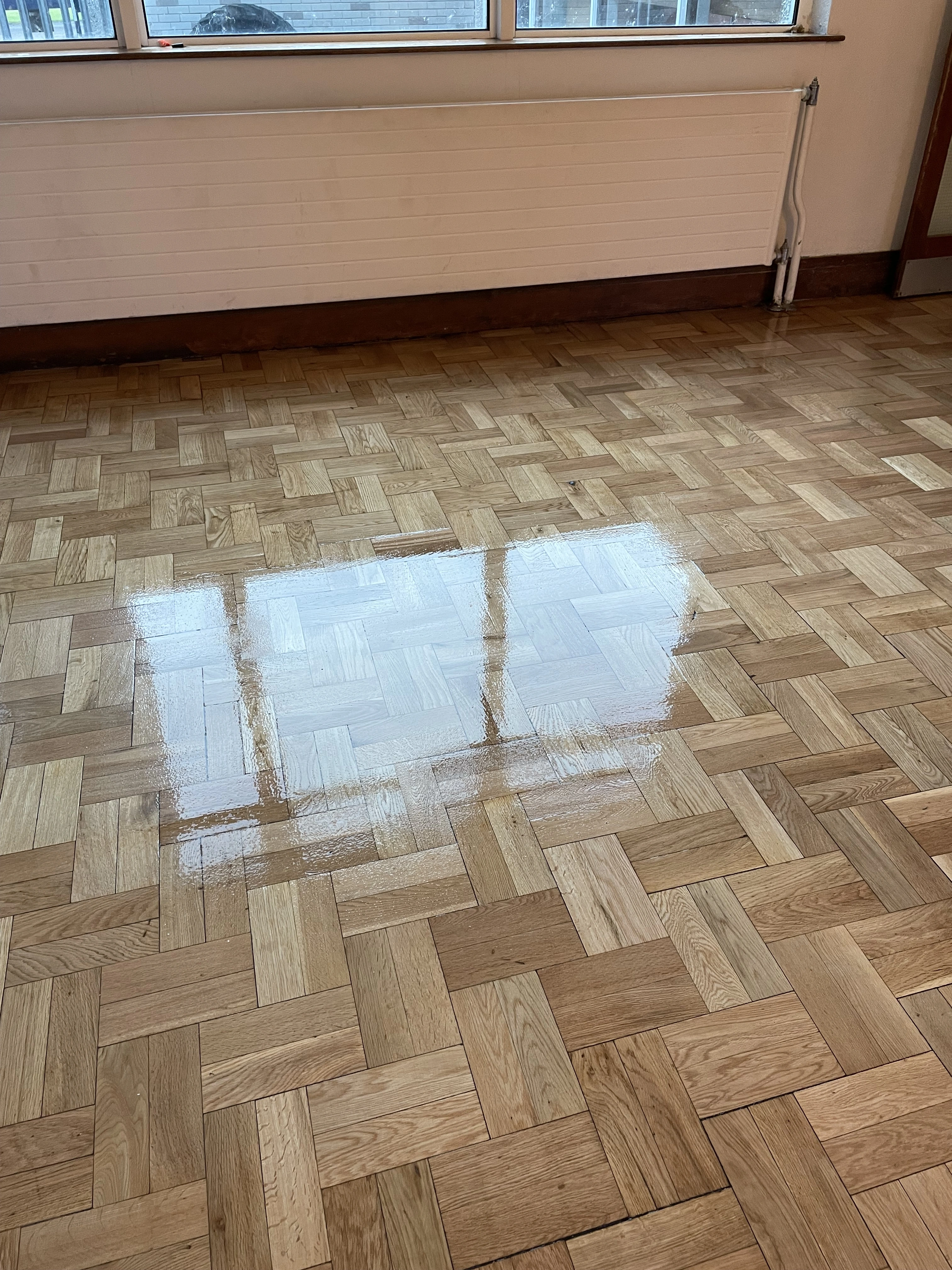 A wooden floor with decorations sanded & stained.