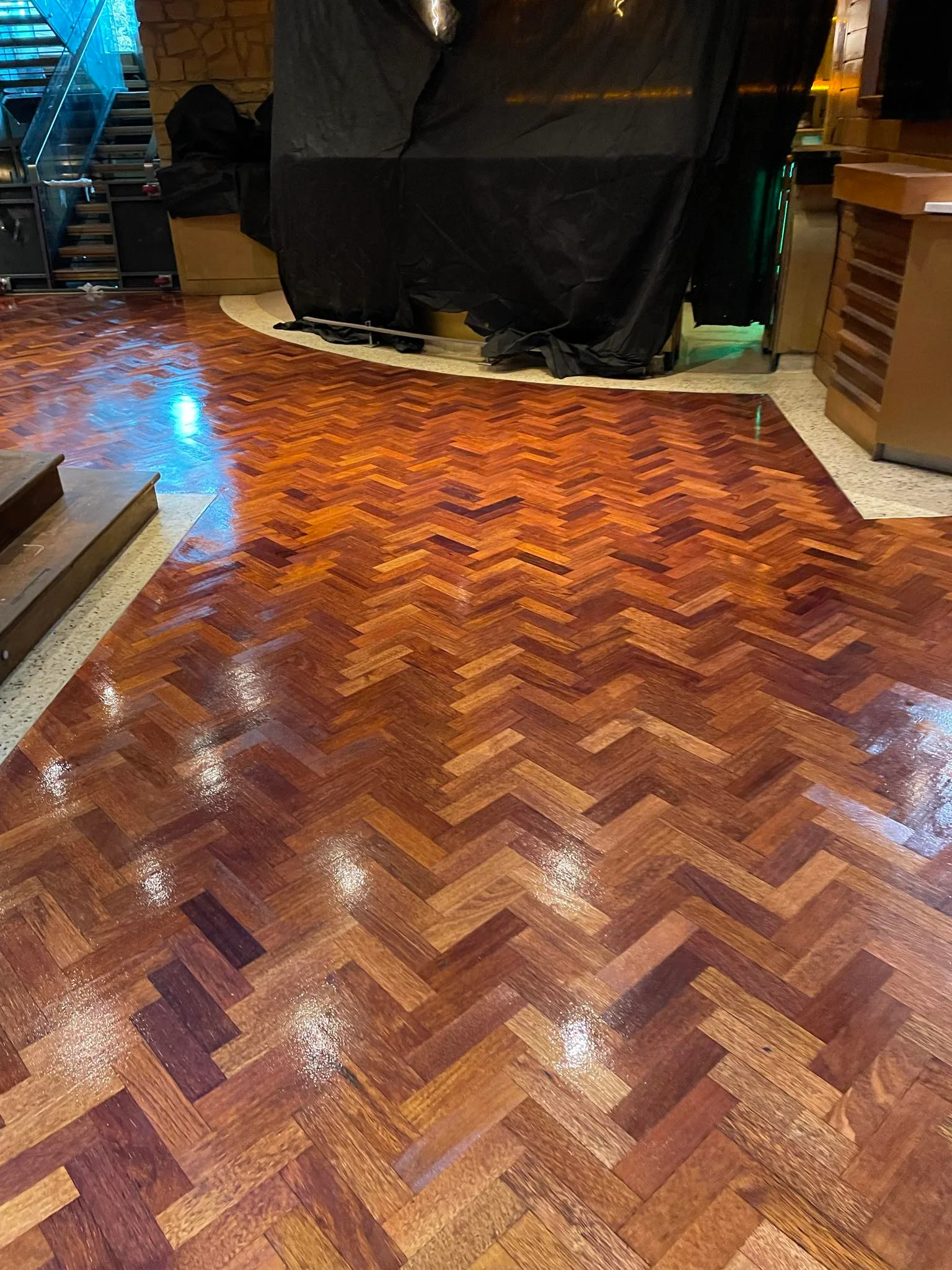 Another business with semi-solid wooden floor sanded & stained.