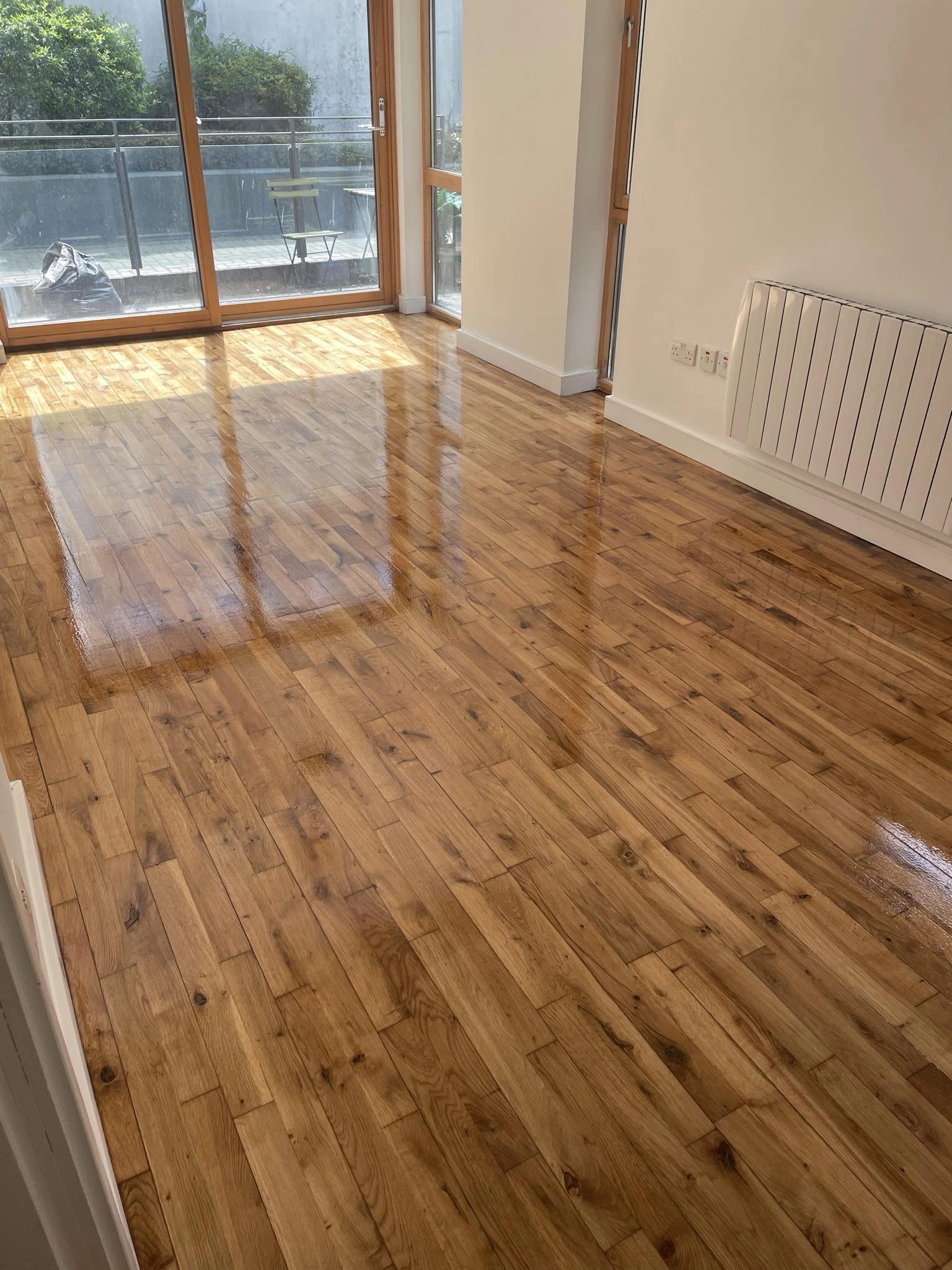 A wooden floor sanded & stained with a nice coat.