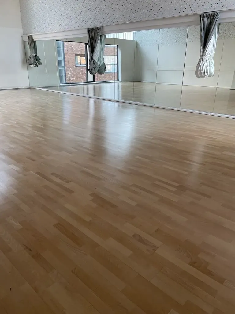 Wooden floor of a gym sanded & stained
